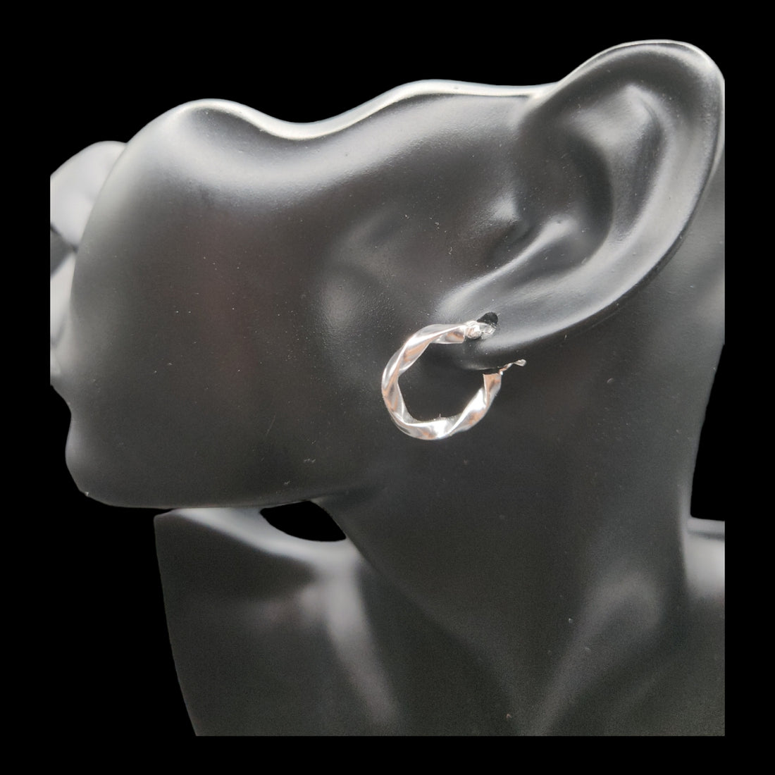 Sterling Silver Twisted Hoop Earrings.